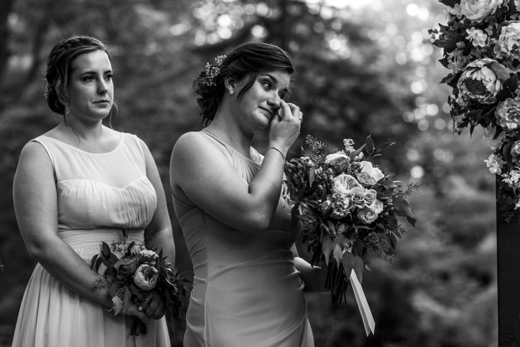 bridesmaid wipes eyes during Strathmere wedding ceremony