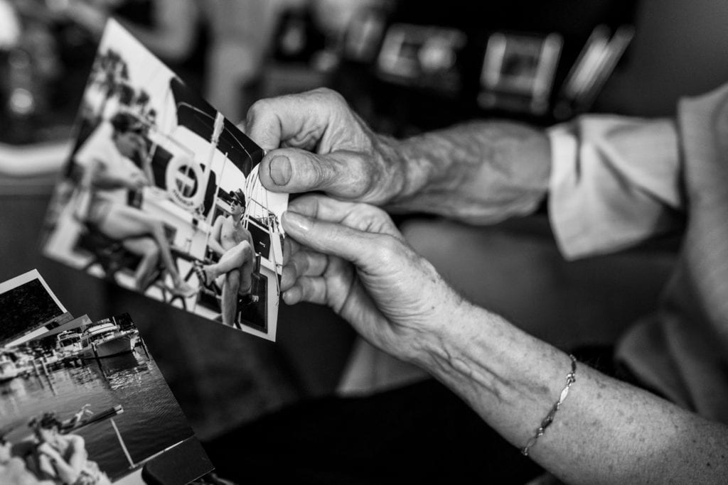 husband and wife go through old family photos