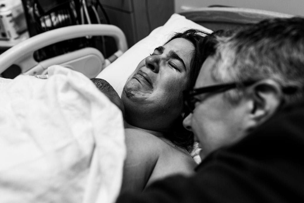 mom cries while holding son for first time