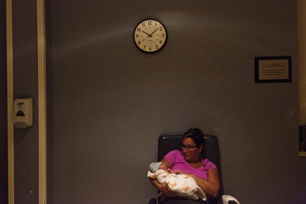 Grandma holds new grandson in quiet hospital room