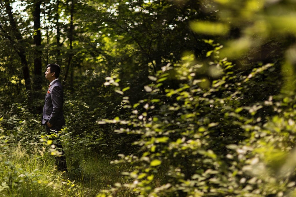 groom waiting for bride in forest area at intimate ottawa park wedding
