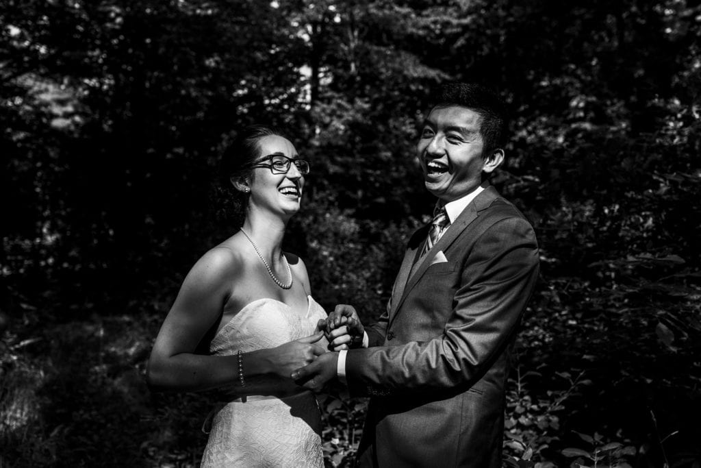 bride and groom celebrating in forest during intimate ottawa park wedding