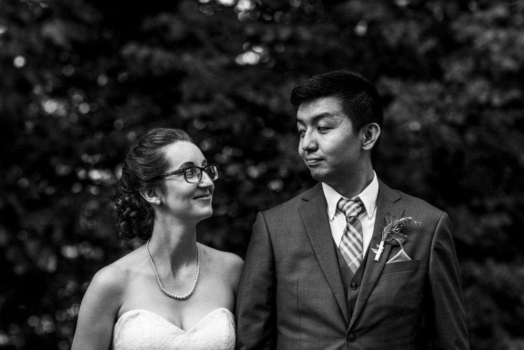 bride and groom share knowing look at intimate ottawa park wedding