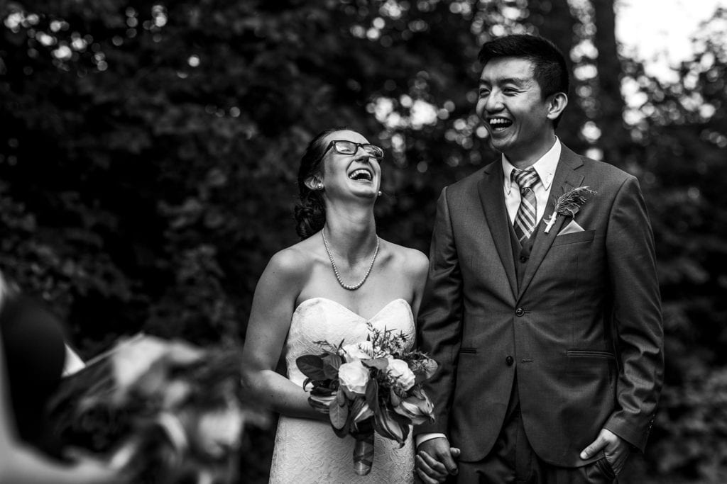 couple laughing heartily during intimate ottawa park wedding