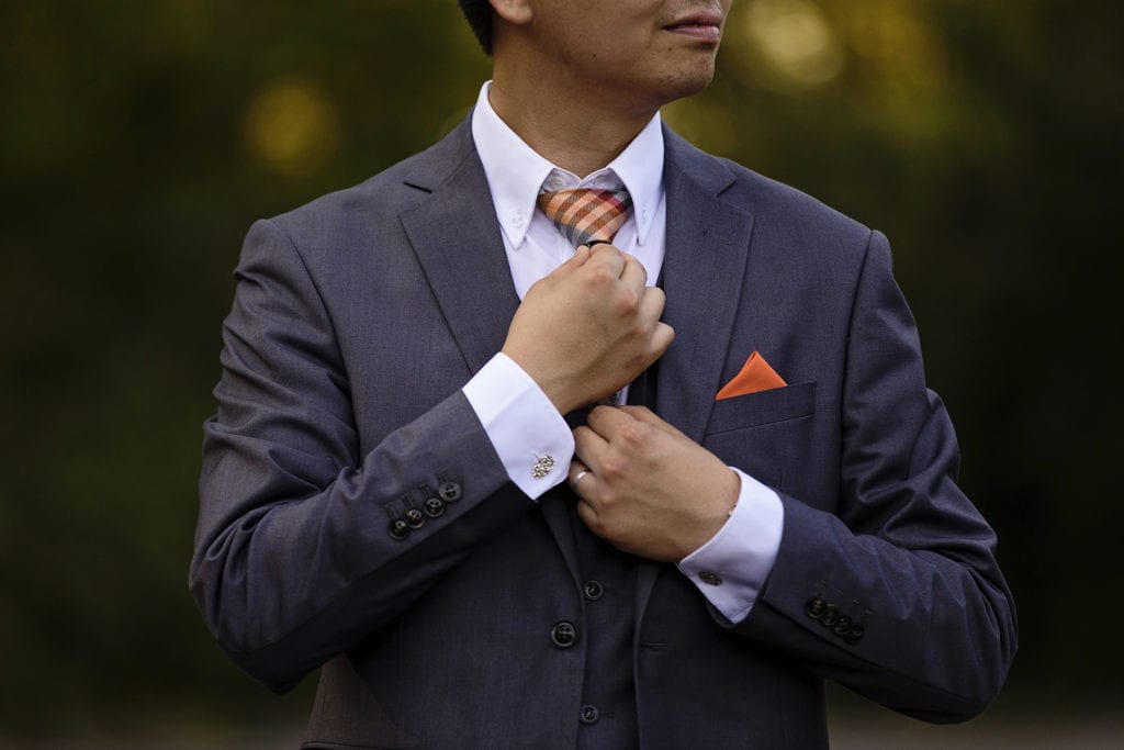 groom's orange pocket square and tie at intimate Ottawa park wedding