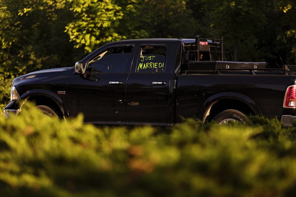 just married graffiti sign on truck at initmate rural Ottawa wedding