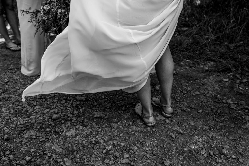 bridesmaid's dress being blown by wind