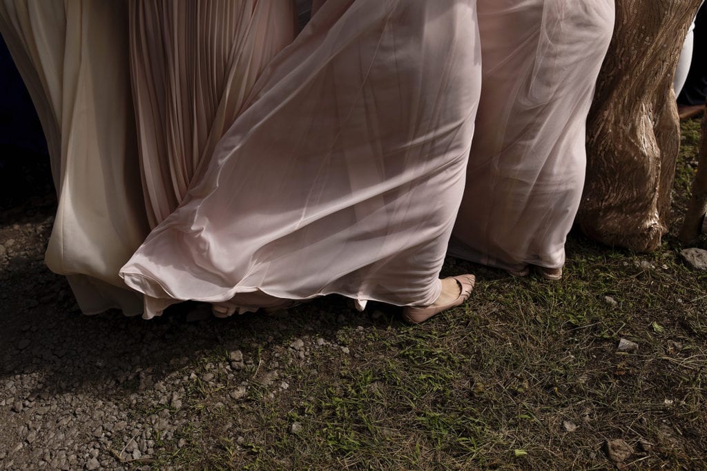 bridesmaids dresses get blown by wind