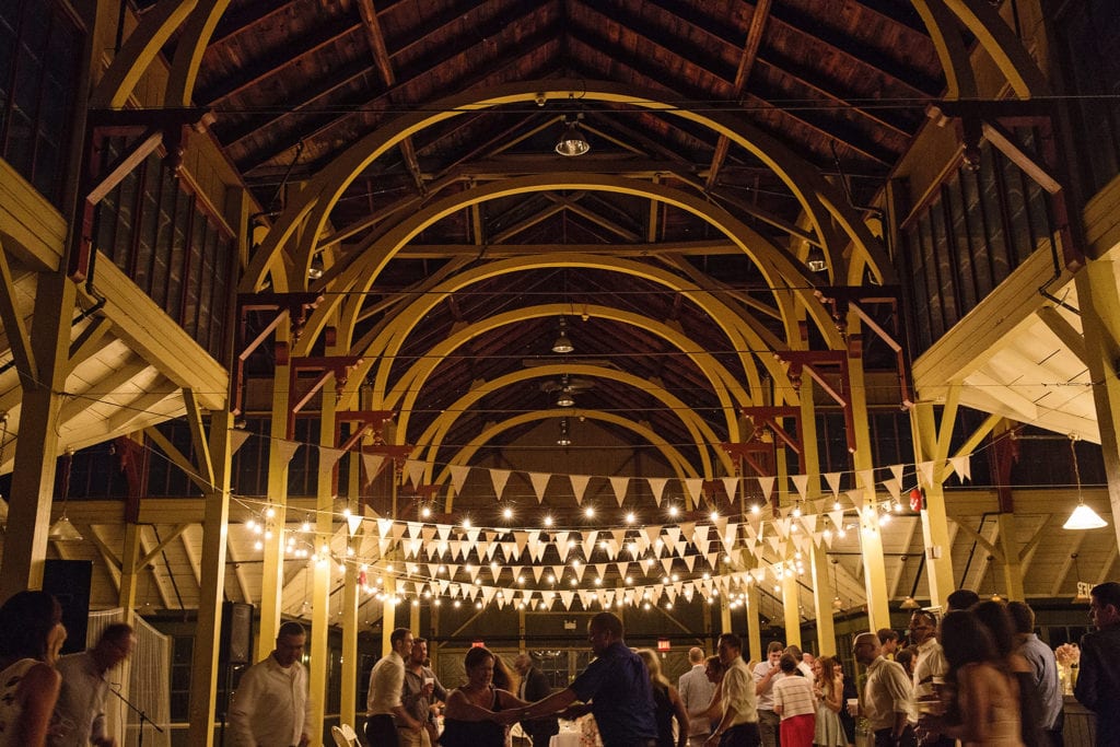couples dance under lights and bunting hung from rafters of Picton Crystal Palace