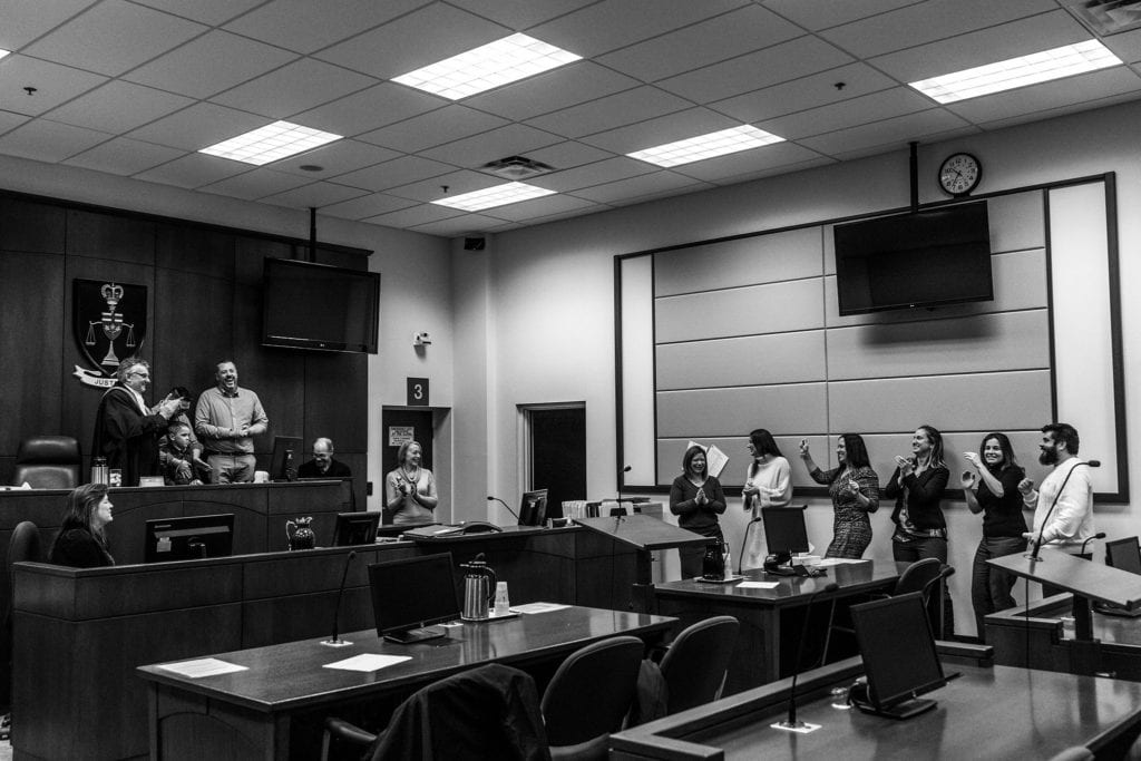 family celebrates adoption proceedings in courtroom of Cornwall Ontario