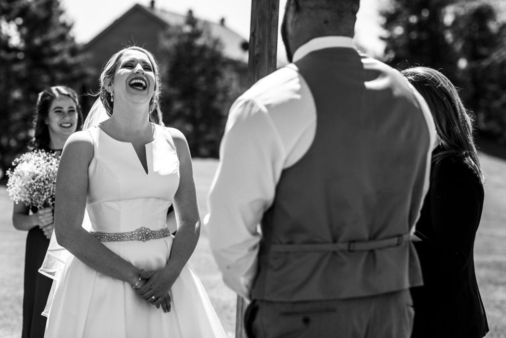 bride laughs during Plantagenet wedding ceremony during Rockland wedding celebration