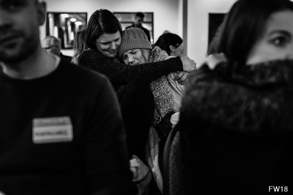 woman hugging crying woman