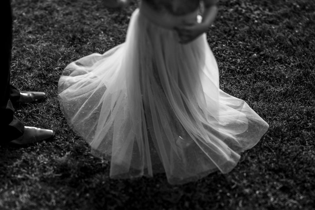 young girl twirls in tulle skirt