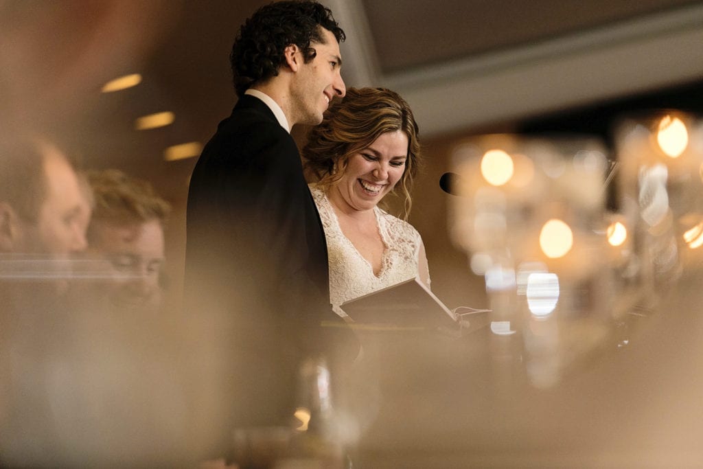 bride and groom laugh during speech at Best Western Cornwall