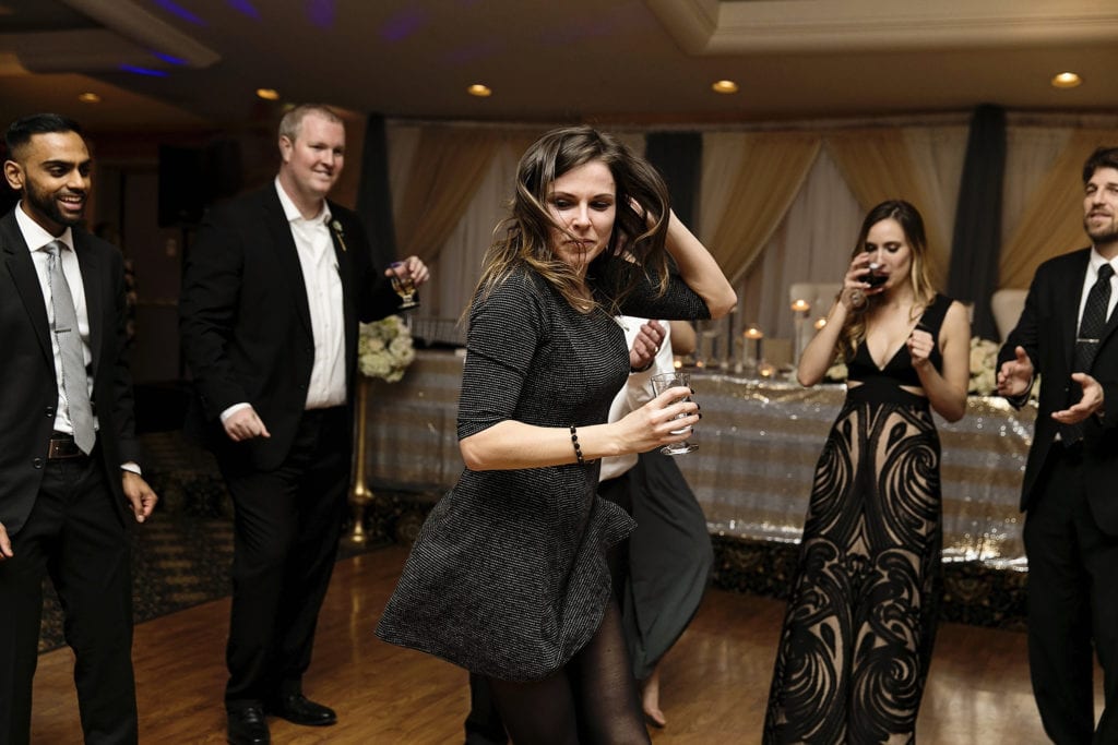 girls dances with hair flying during Best Western Cornwall wedding reception
