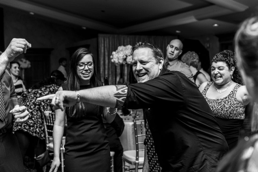 enthusiastic dancing and pointing by wedding guest at Best Western Parkway Cornwall wedding reception