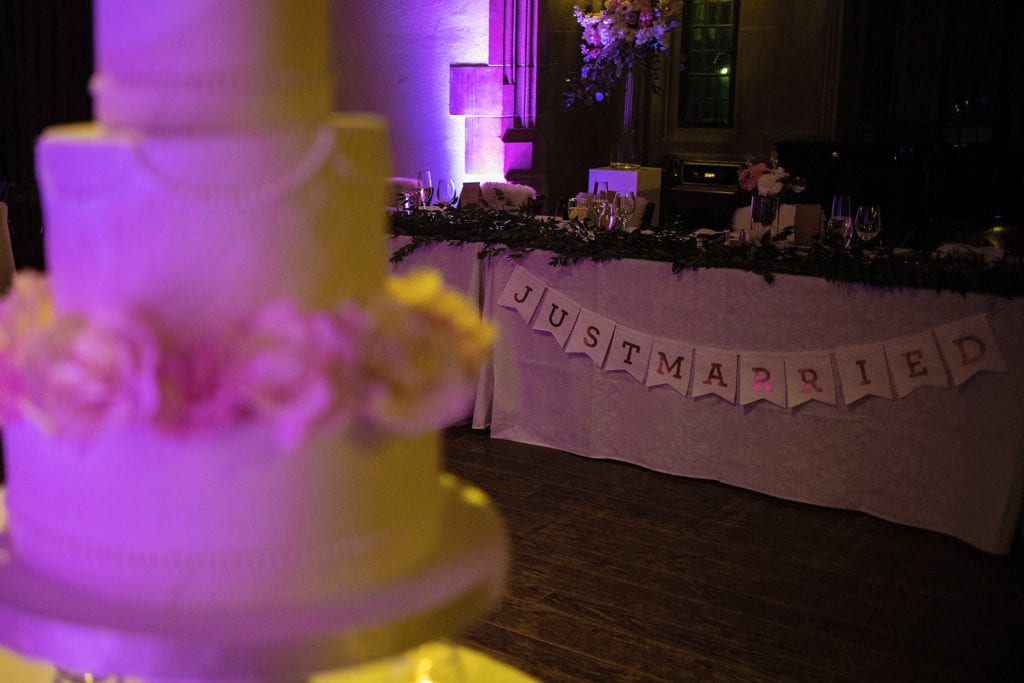 wedding cake and head table in Hart House Toronto wedding ballroom