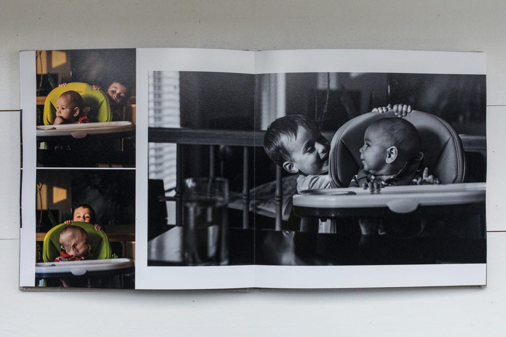 documentary family photography album pages featuring boy playing peek-a-boo with brother in high chair