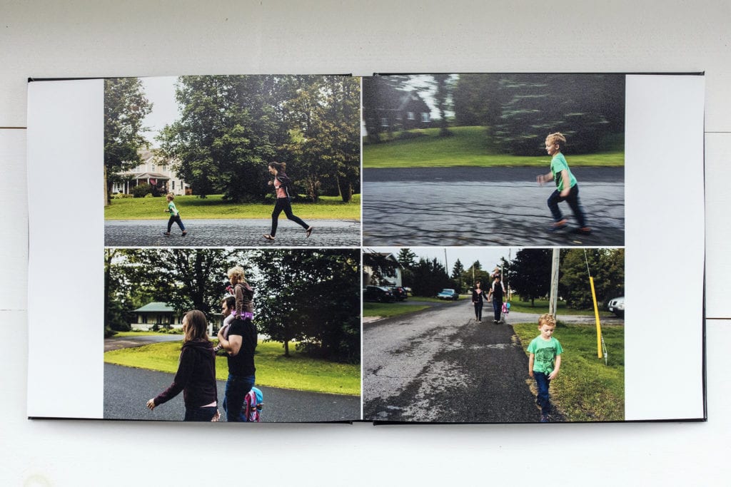 documentary family photography album pages featuring boy running down street ahead of family