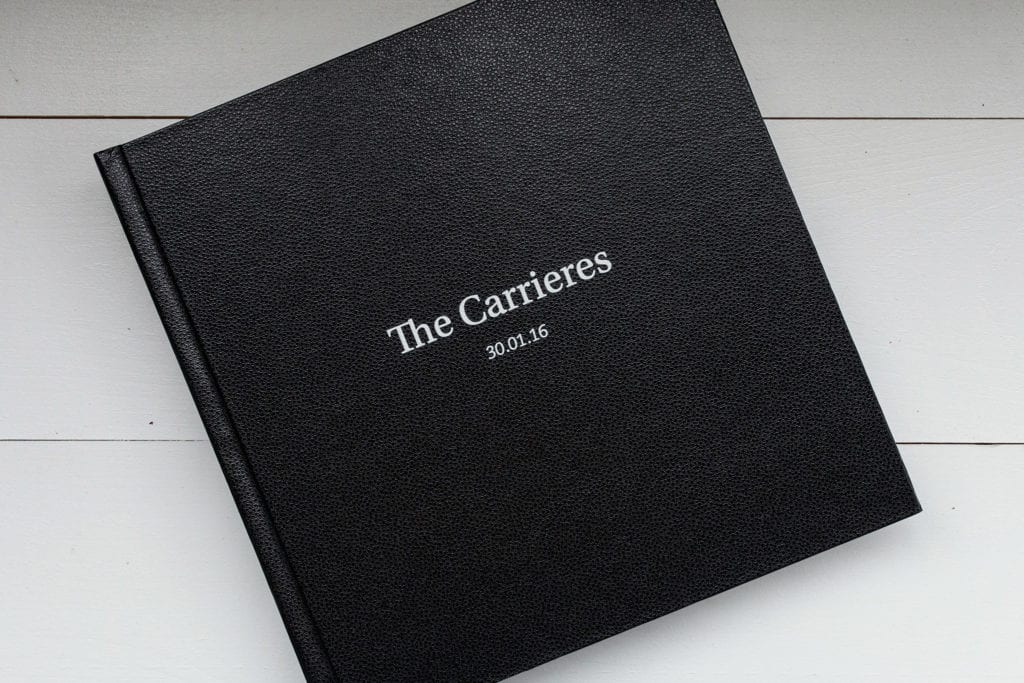 Black documentary family photography album cover labelled "The Carrieres"