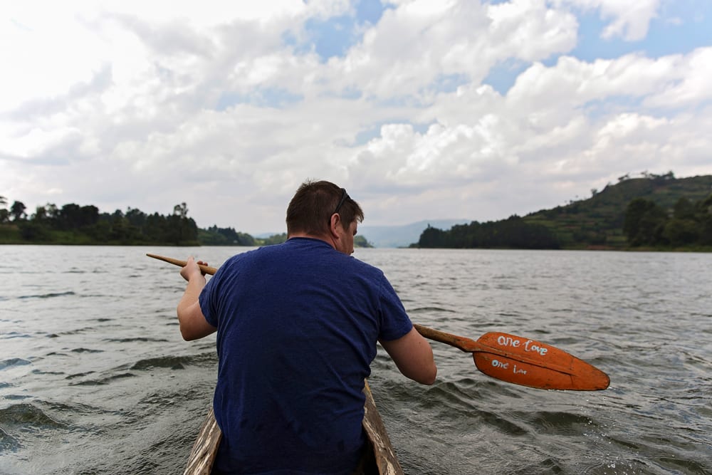 man in dugout canoe