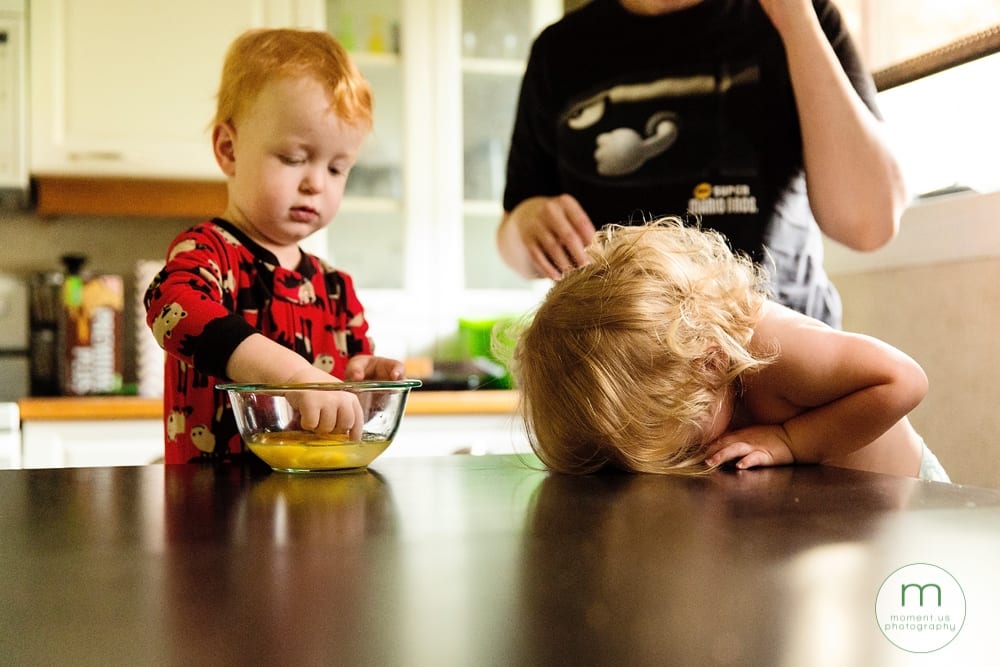 boy cracking egg while girl cries