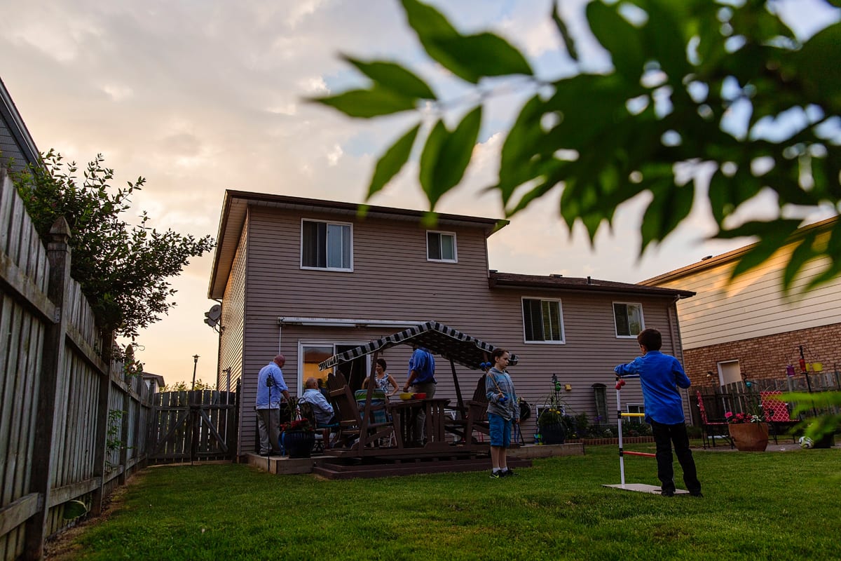 candid summer backyard family gathering