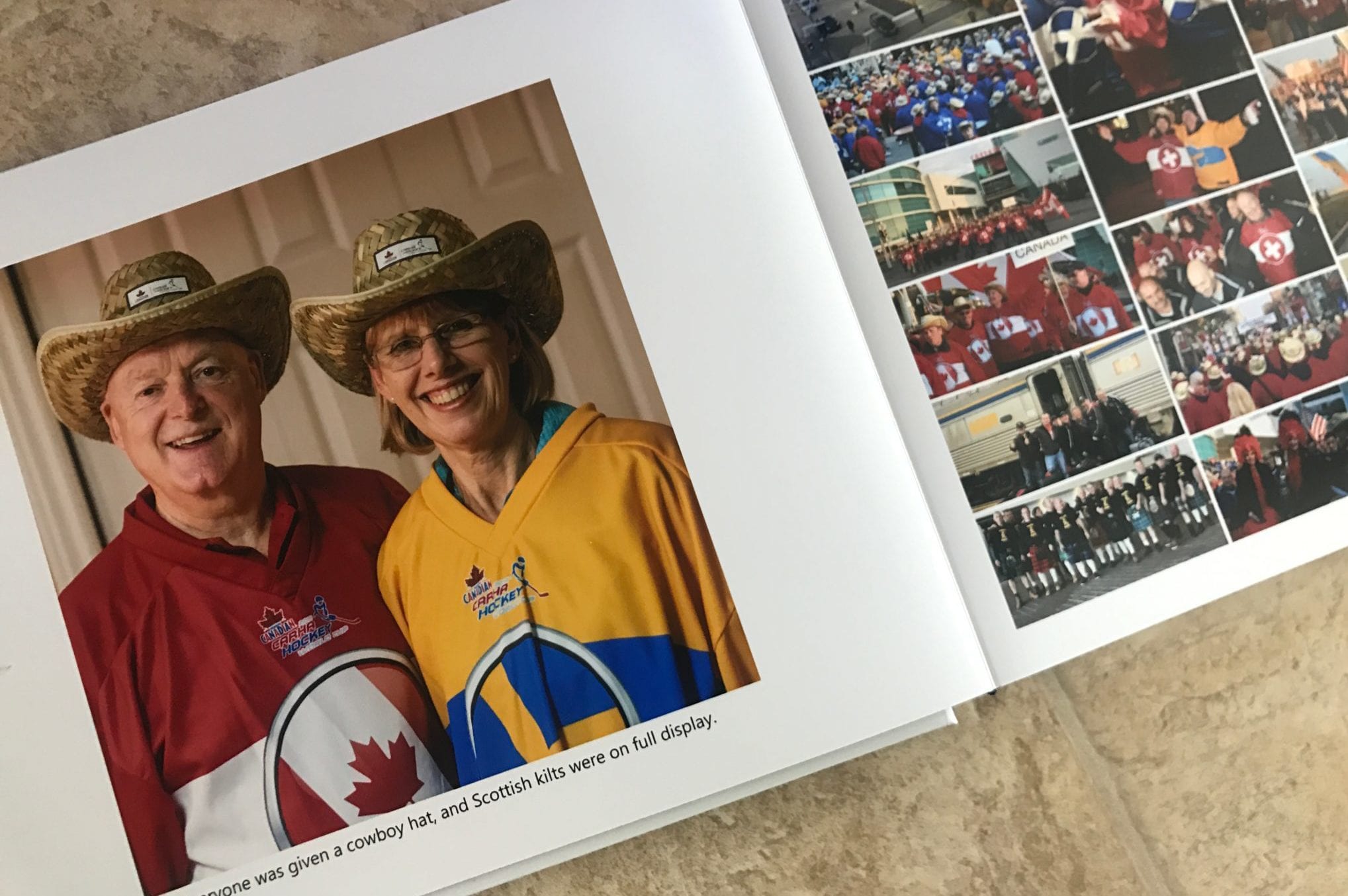 Man and woman with cowboy hats and large collage page of team members