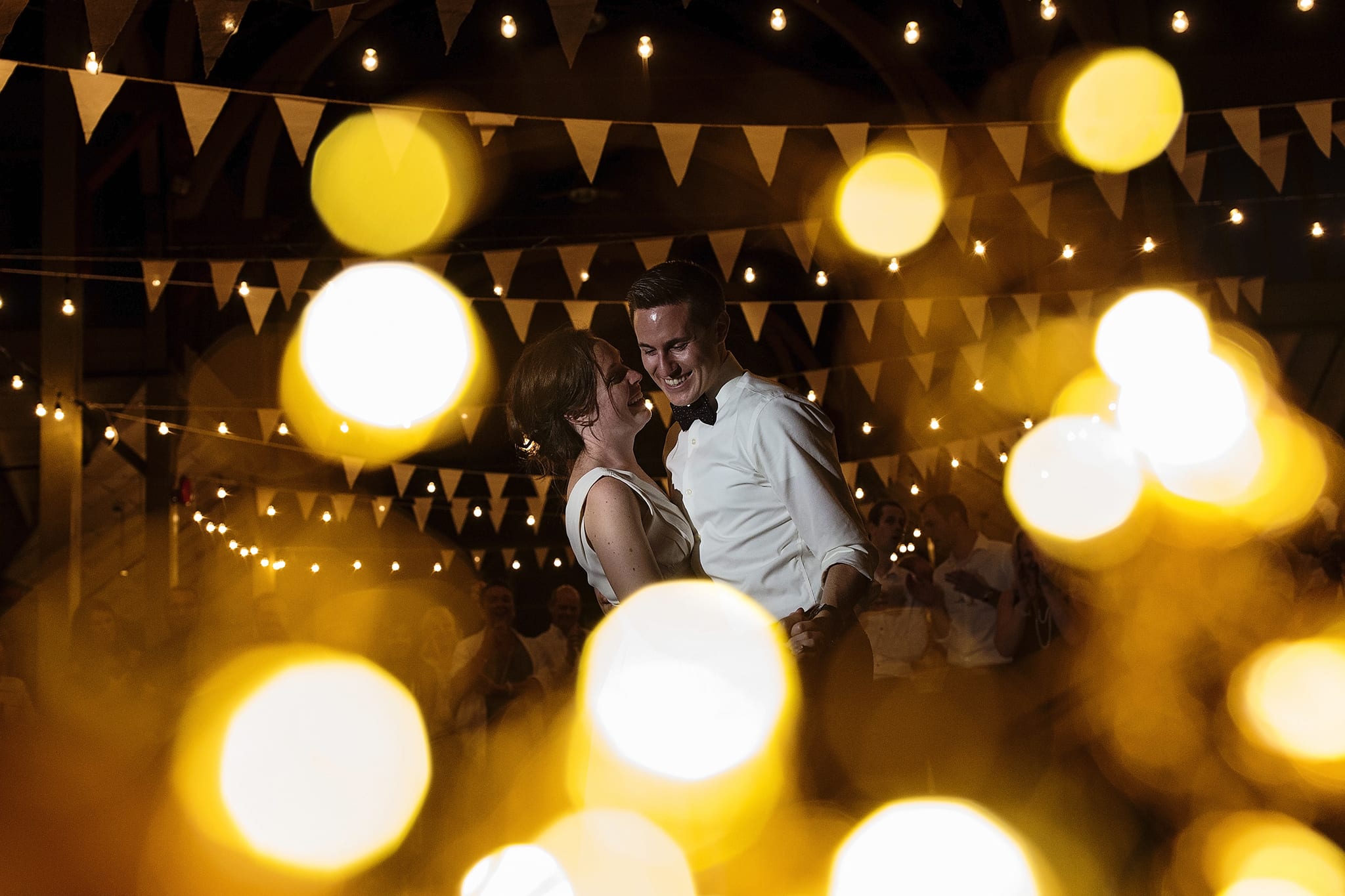 bride and groom smile during first dance together at Picton Crystal Palace