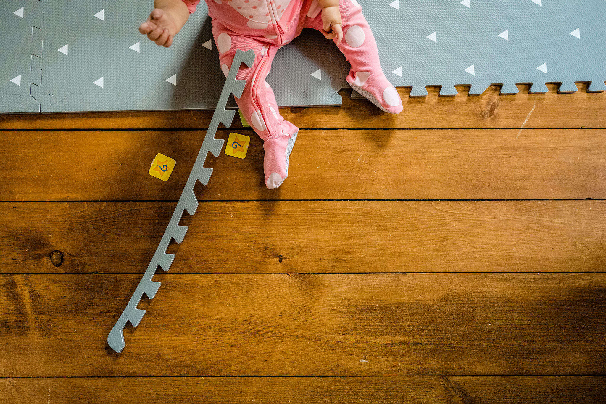 Child feet on play mat