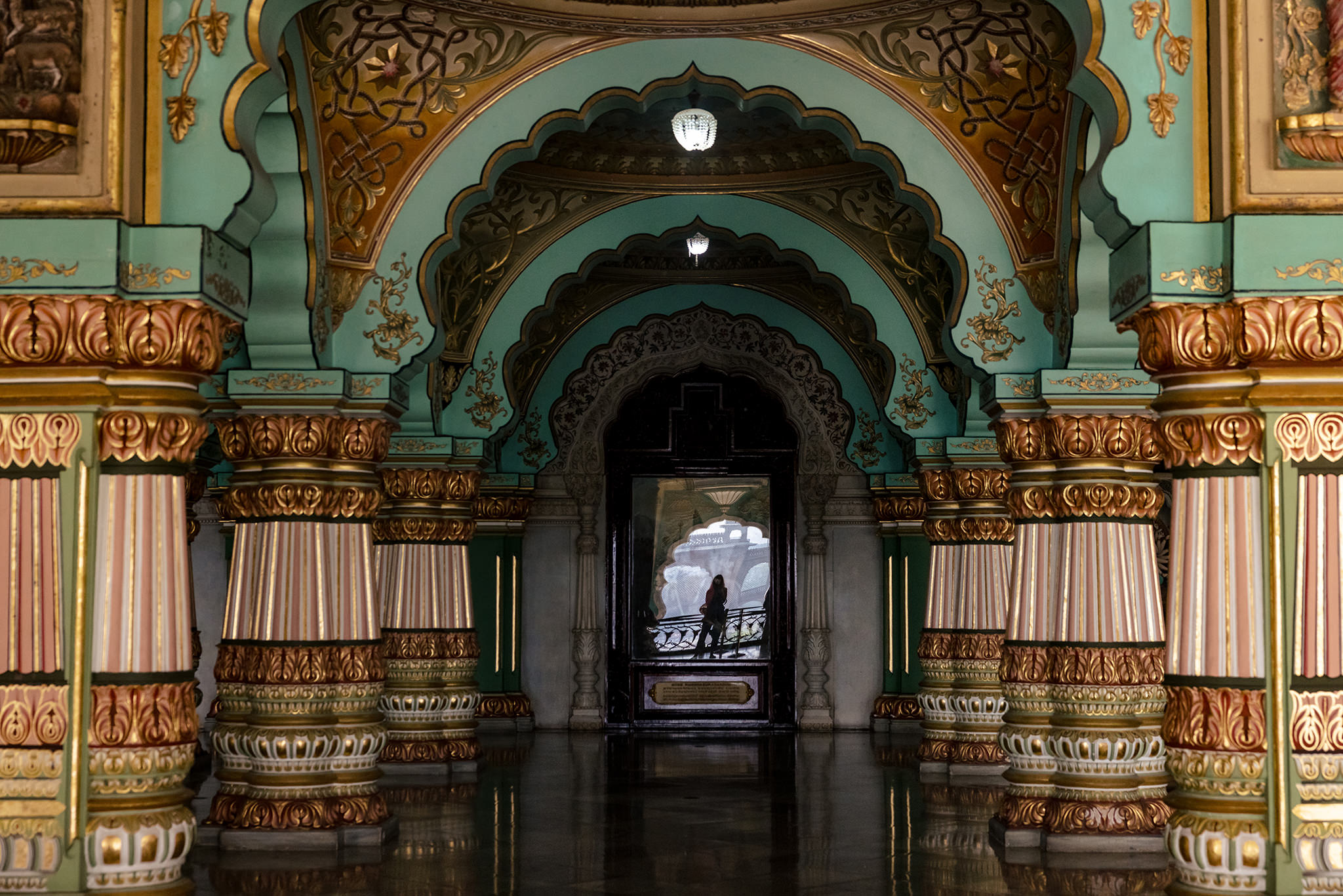 Self-portrait reflected in glass of Durbar Hall at Mysore Palace
