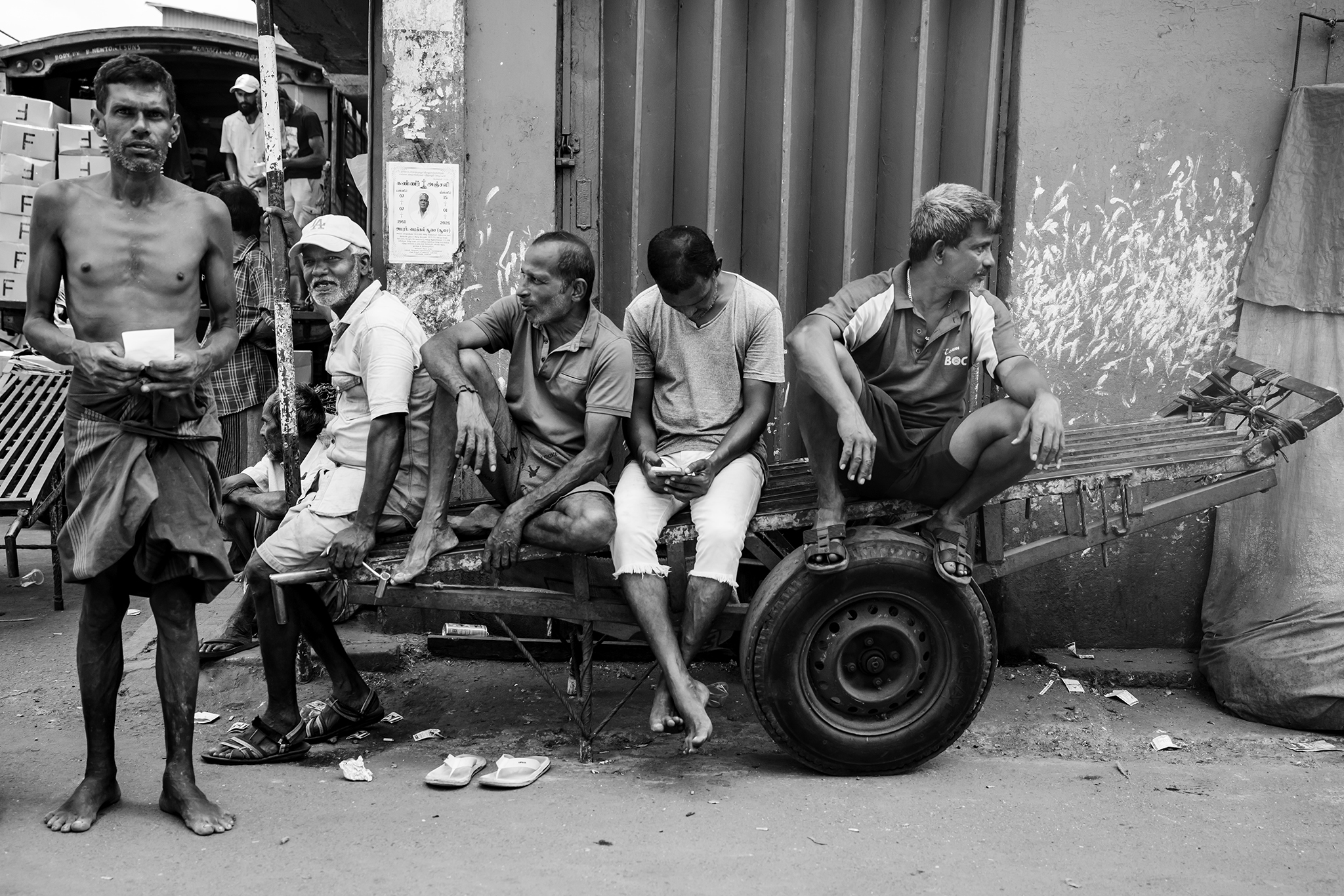 Pettah Market workers rest on one of the market's many pushcarts