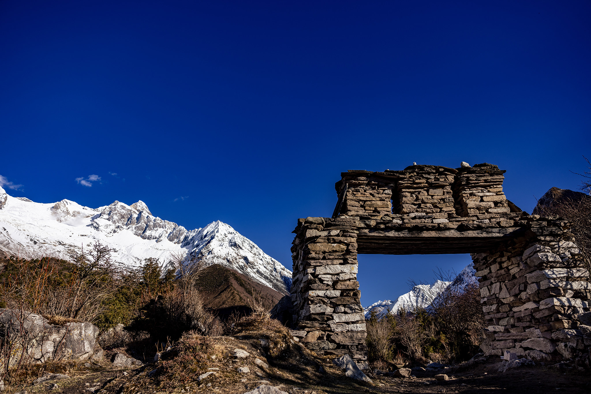 Gate with Manaslu Circuit peaks in background
