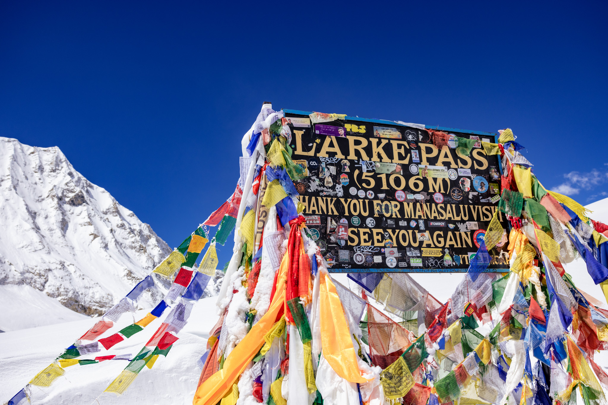 Prayer flags atop Larke Pass on Manaslu Circuit
